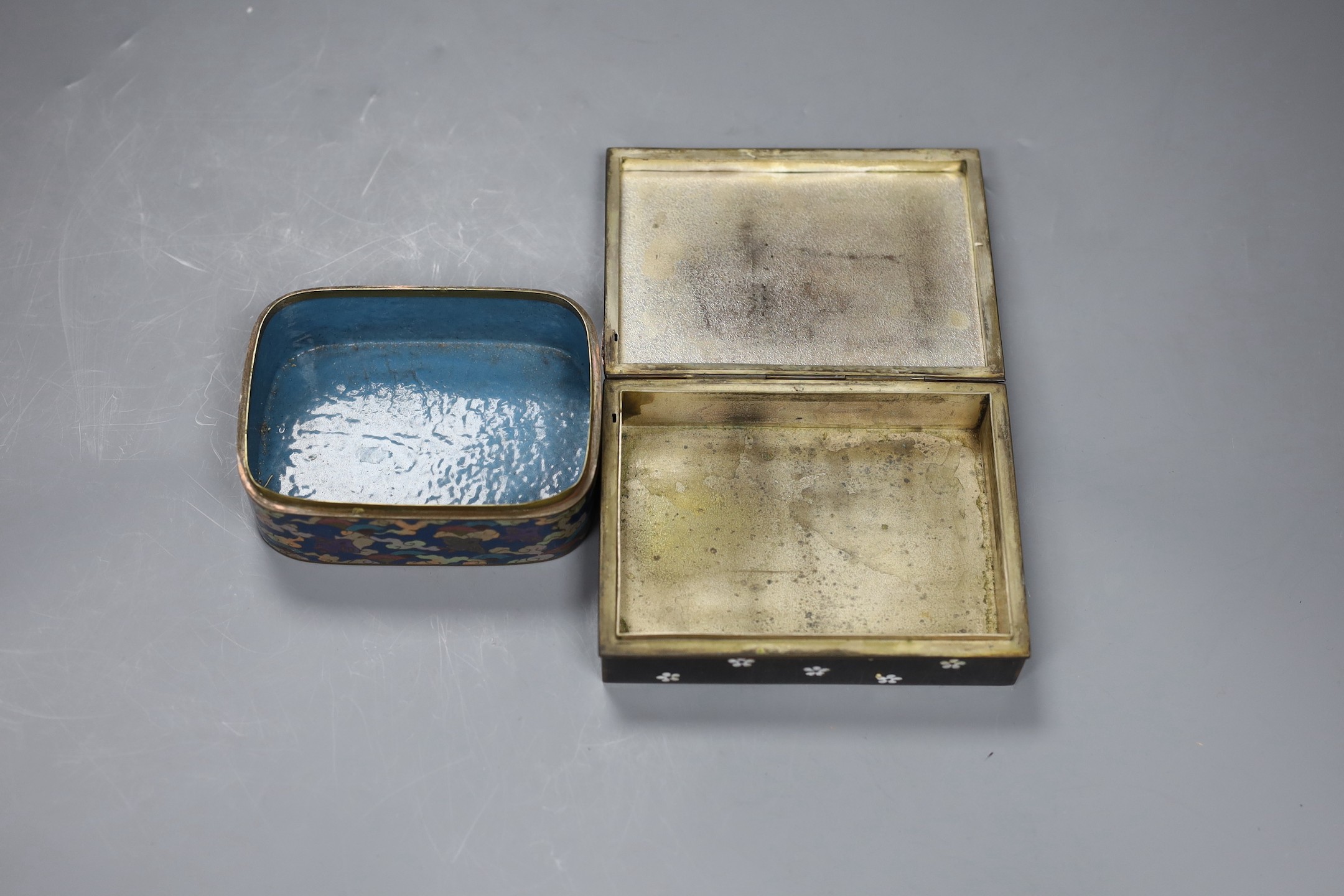 A Japanese silver wire cloisonné enamel box and cover, Meiji period and an early 20th century Japanese cloisonné enamel cigarette box, 13.5cms wide x 10cms deep